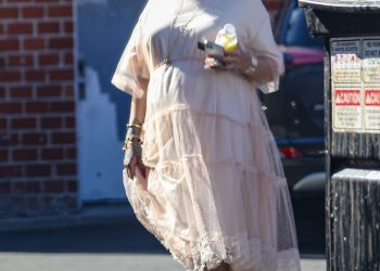 Rihanna Swapped Her Bump-Baring Crop Tops for an Uncharacteristic Babydoll Dress