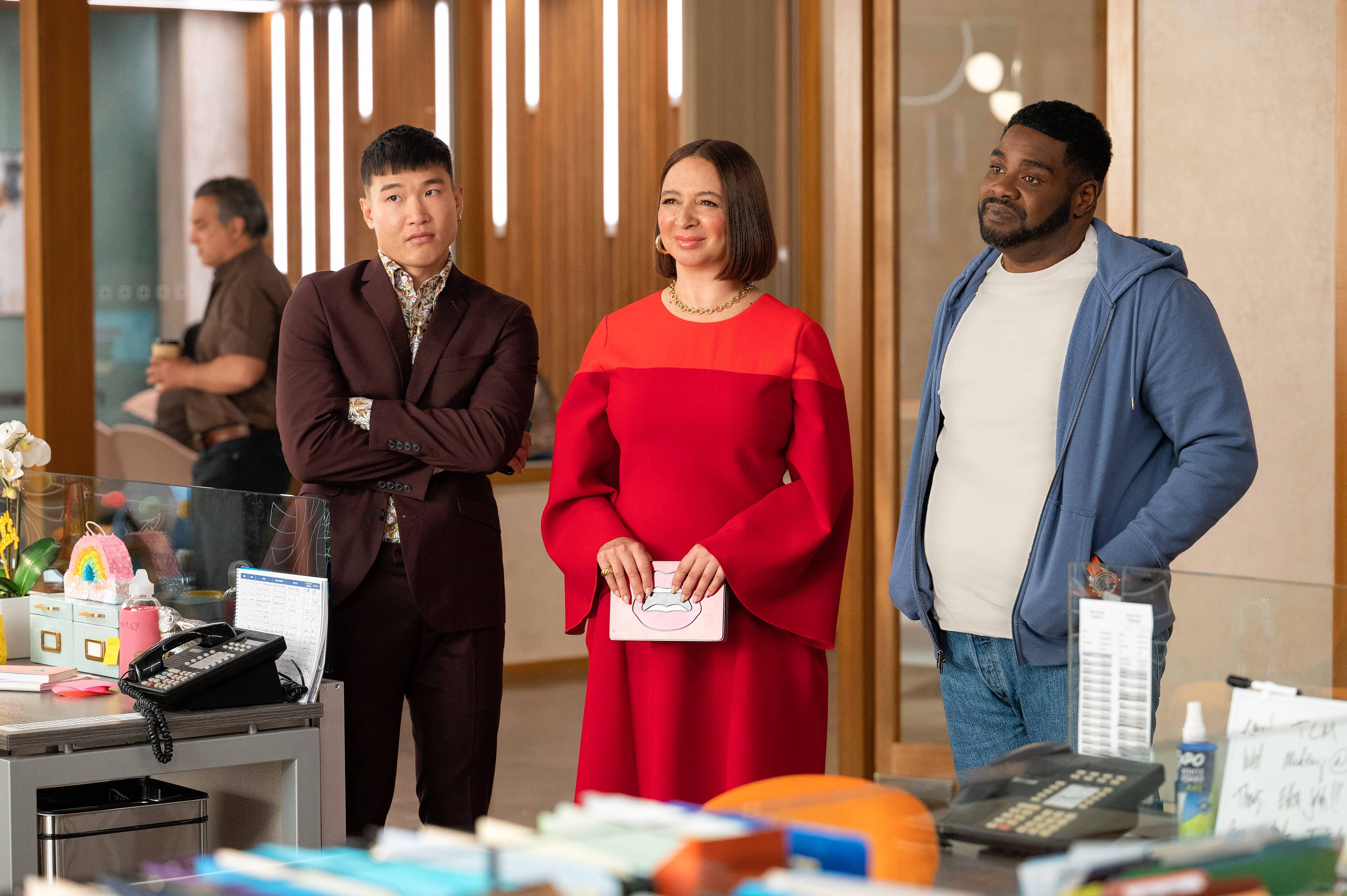Loyal assistant Nicholas (Plainfield native Joel Kim Booster), left, and cousin Howard (Ron Funches) stand by Molly (Maya Rudolph) in "Loot," premiering Friday, June 24, on Apple TV+.