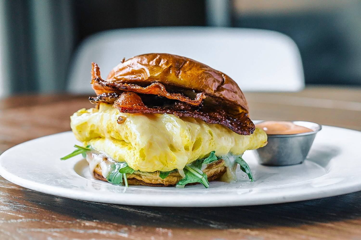 Nosh on Beatrix's bacon, cheddar and egg sandwich during brunch on July 4.
