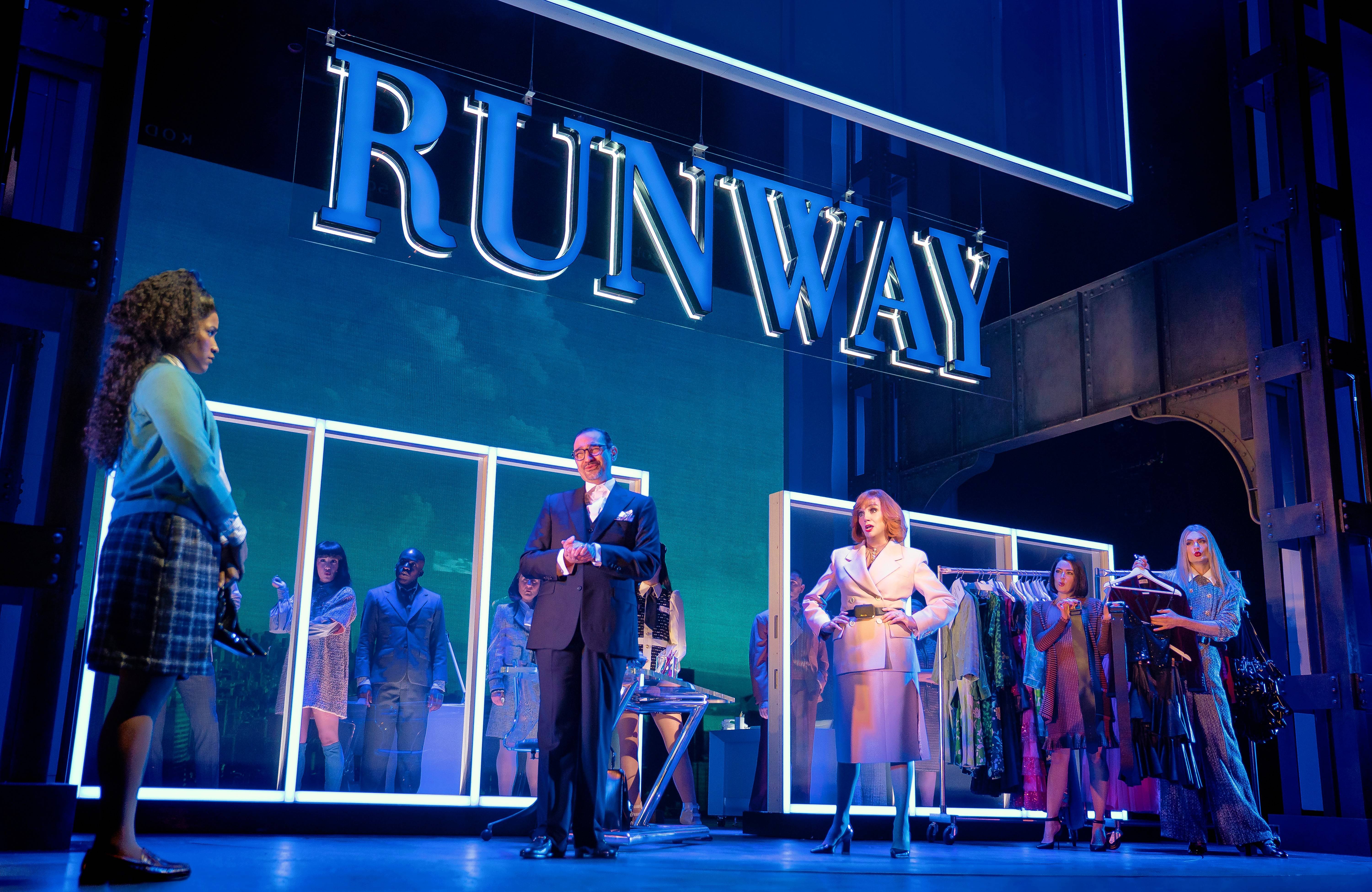 "Runway" magazine junior assistant Andy Sachs (Taylor Iman Jones), left, is dressed down for scoffing at two similar belts by fashion editor Nigel Owens (Javier Muñoz) and editor-in-chief Miranda Priestly (Beth Leavel) in "The Devil Wears Prada, The Musical." The world-premiere Broadway tryout continues at Chicago's James M. Nederlander Theatre through Aug. 21.