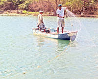  Fishermen on the Yasica River in the Dominican Republic cast their nets. Photo courtesy of Victor Block. 