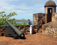  A visitor to Fuerte de San Felipe in the Dominican Republic surveys the landscape. Photo courtesy of Victor Block. 
