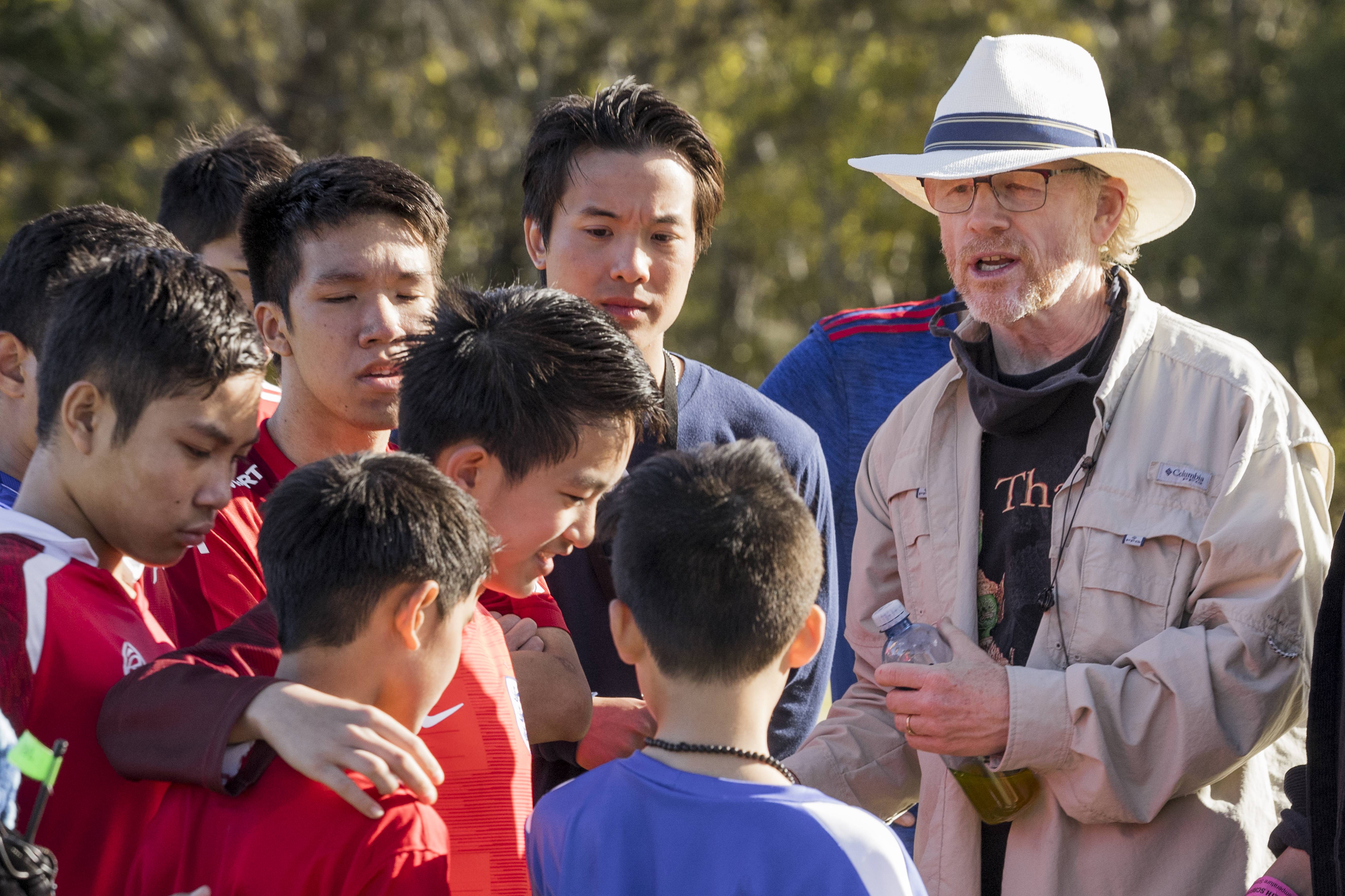 Director Ron Howard, right, gives instructions on the set of "Thirteen Lives."
